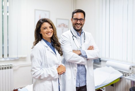 7038-file1-portrait-smiling-young-doctors-standing-together-portrait-medical-staff-inside-modern-hospital-smiling-camera.jpg